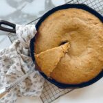 cast iron skillet banana bread cooling on rack
