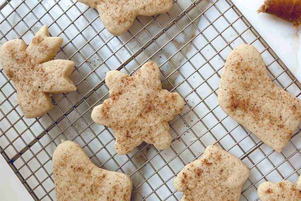 nutmeg dusted sour cream sugar cookies cooling on rack