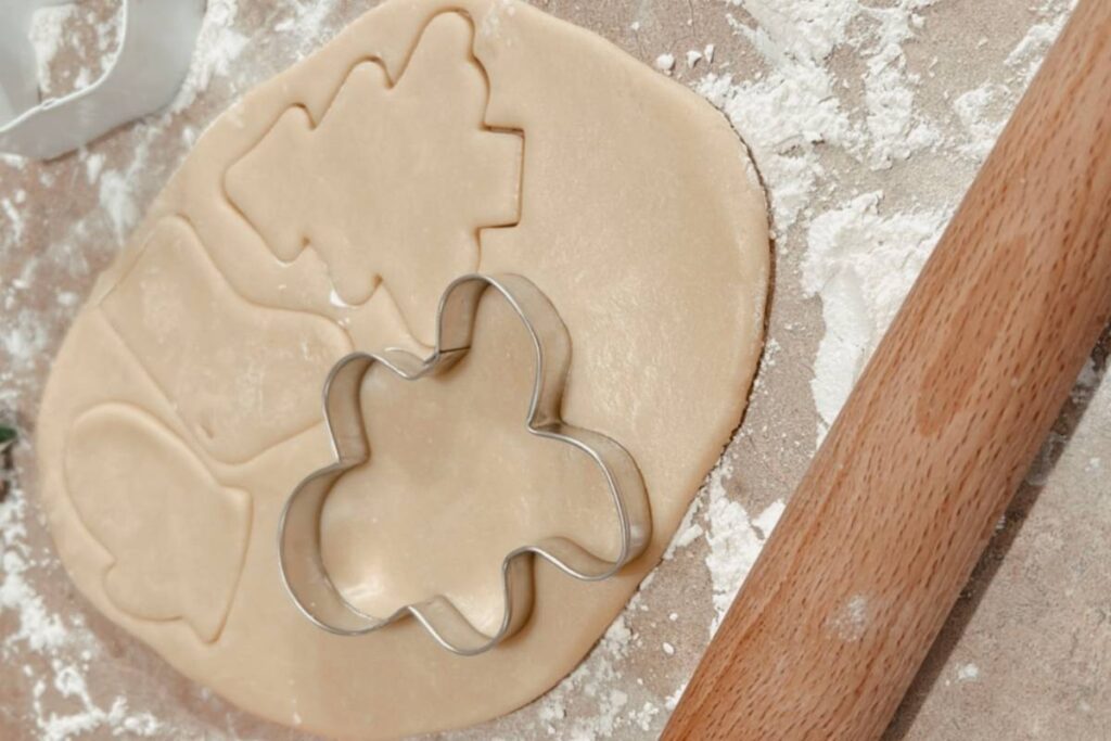 Christmas cookie cutter cutting sour cream sugar cookie dough