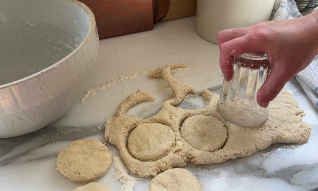 cutting out strawberry shortbread biscuits